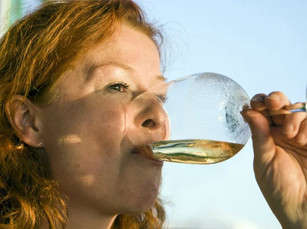 Woman drinking white wine — Stock Photo, Image