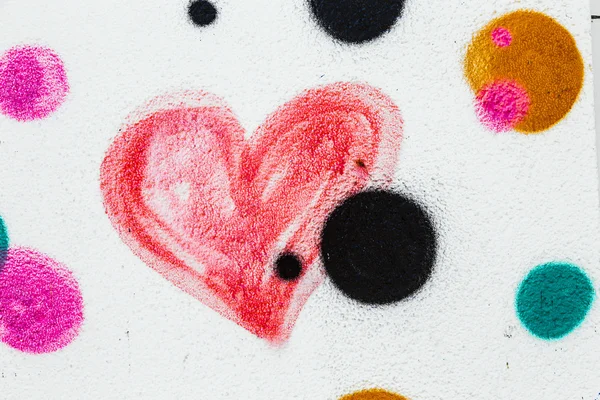 Red painted heart on a concrete wall — Stock Photo, Image