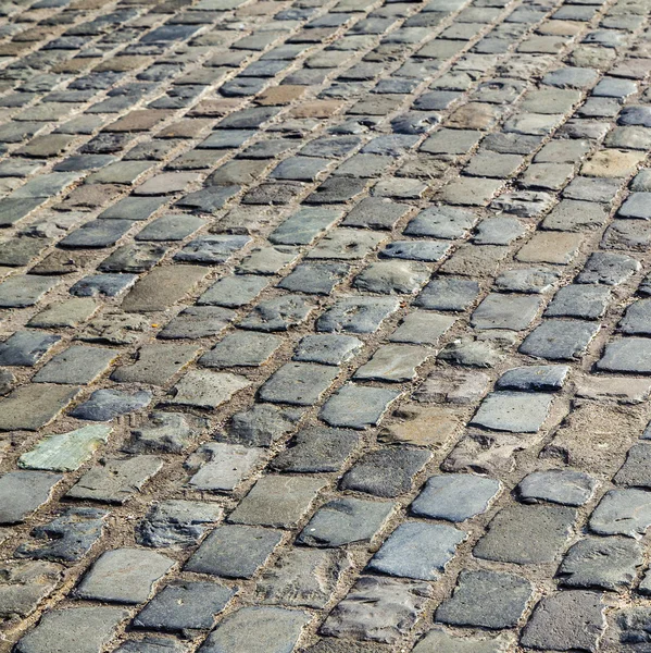 Cobbled road as background — Stock Photo, Image