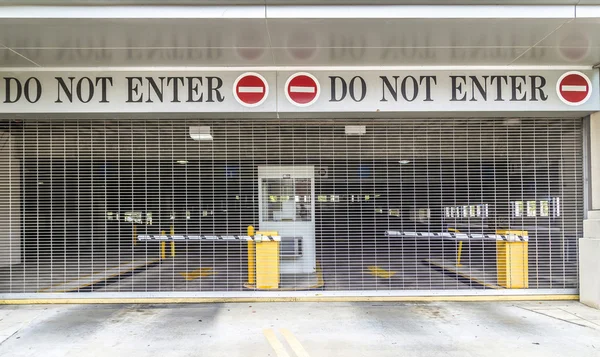 Do not enter sign with closed roller blind at a garage — Stock Photo, Image