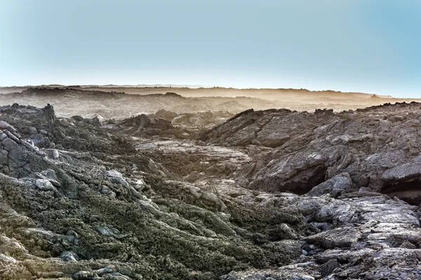 Coast a köveket a vulkáni áram — Stock Fotó