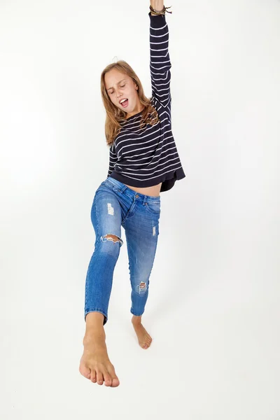 Young beauty  girl flying in jump with brown hair — Stock Photo, Image