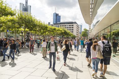 people walk along the Zeil in Frankfurt clipart