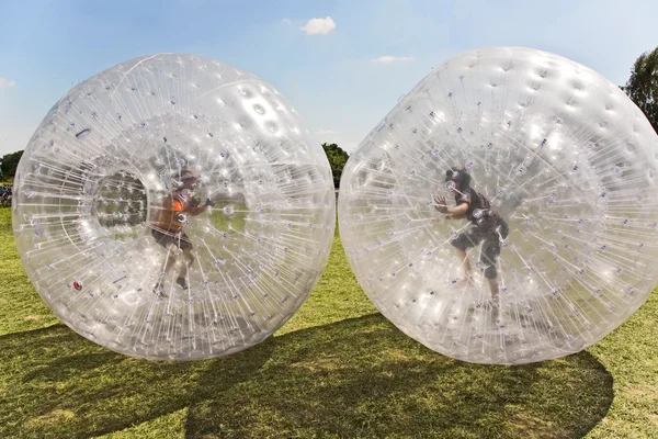 Children have a lot of fun in the Zorbing Ball — Stock Photo, Image