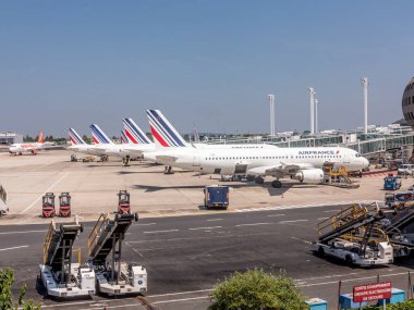 Paris, France - June 11, 2015: airfrance aircraft parks at the new Terminal of Charles de Gaulle airport in Paris, France. clipart
