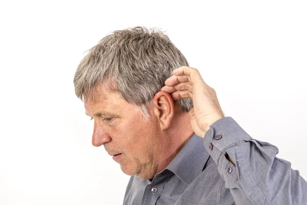 Mature Man Puts Hearing Aid Ear — Stock Photo, Image