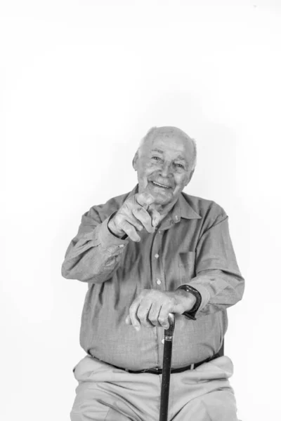 Happy Elderly Man Sitting Front White Background Giving Handsign — Stock Photo, Image