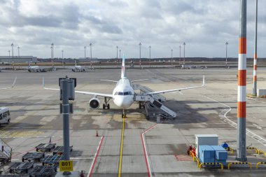 Berlin, Germany - February 7, 2022: airfield and view to Ryanair aircraft  at Willy Brandt airport in Berlin. clipart