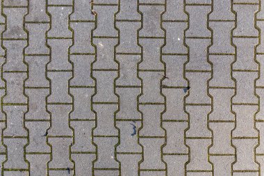 Zemindeki yeni kaldırım taşlarının harmonik desenlerinin arkaplanı