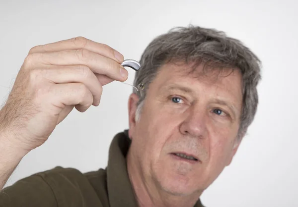 Senior Man Wears Hearing Aid Places Ear — Stock Photo, Image