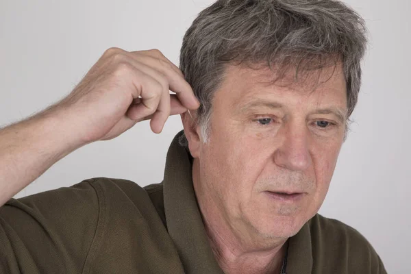 Senior Man Wears Hearing Aid Places Ear — Stock Photo, Image