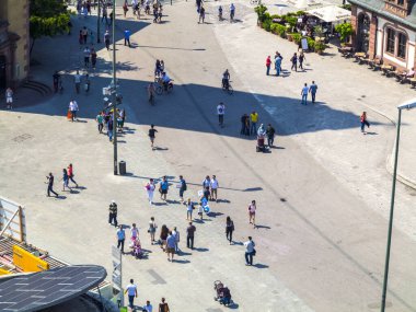 Frankfurt, Germany - June 8, 2013: people walk along the Zeil in Midday  in Frankfurt, Germany. Since the 19th century it is of the most famous and busiest shopping streets in Germany. clipart