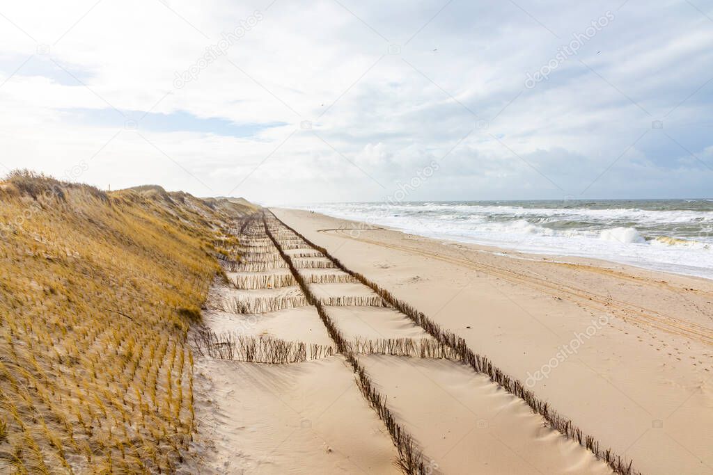 dune landscape at the west beach in List a t the island of Sylt in Germany with north sea view at low tide