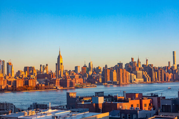 New York, USA - November 7, 2018: view to Skyline of New York in golden sunset light, USA.