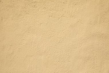 Sarı arkaplan olarak harmonik boyanmış alçı duvar deseni