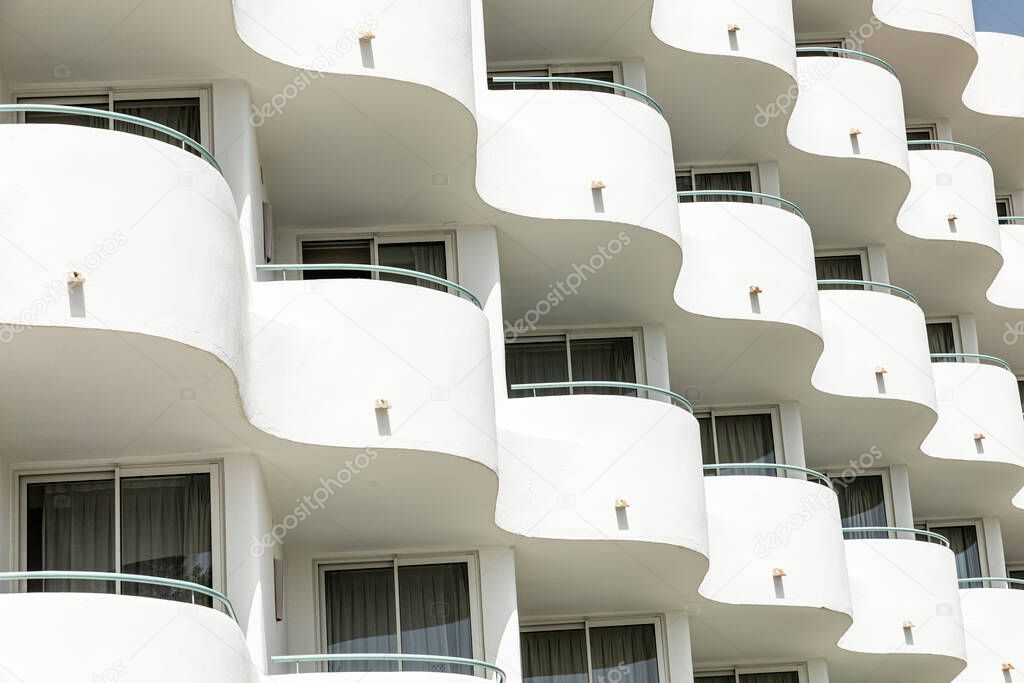 symbolic facade of a hotel in the mediterranean sea with round balconies as architecture feature