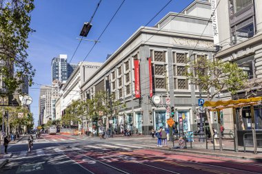 San Francisco, USA - May 19, 2022: streetview downtown San Francisco  with view to facade of Nordstrom and Bloomingdales building.