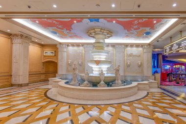 Las Vegas, USA - May 23, 2022:  inside  the Venetian Hotel and casino awith decoration in old italian style and fountain with sculptures.