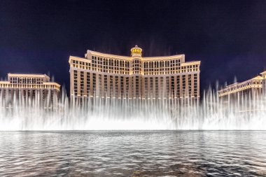 Las Vegas, Nevada, USA -May 23, 2022 : The Fountains of Bellagio at night. This feature performs choreography with water, music and light in front of the Bellagio hotel and casino.