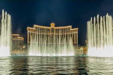 Las Vegas, Nevada, USA -May 23, 2022 : The Fountains of Bellagio at night. This feature performs choreography with water, music and light in front of the Bellagio hotel and casino.