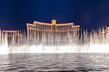 Las Vegas, Nevada, USA -May 23, 2022 : The Fountains of Bellagio at night. This feature performs choreography with water, music and light in front of the Bellagio hotel and casino.