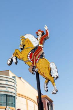 Las Vegas, USA - May 24, 2022: The Old Hacienda Horse neon sign high above the Fremont Street Experience, a popular, busy area downtown Las Vegas that offers many historical attractions.