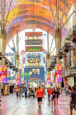Las Vegas, USA - May 24, 2022: Hustle and bustle of crowds during the day on the famous Fremont Street in the heart of downtown Las Vegas with its Casinos, Neon Lights and Street Entertainment.