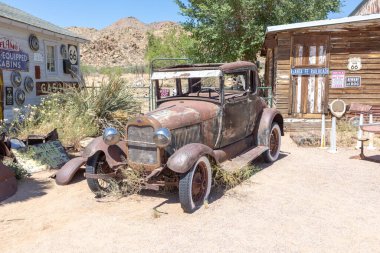 Hackberry, USA - May 25, 2022: Hackberry General Store with an old rusty vintage car in Hackberry , Arizona, USA. Hackberry General Store is a popular museum of old Route 66.