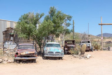Hackberry, USA - May 25, 2022: old rusty vintage cars in Hackberry , Arizona, USA. Hackberry General Store is a popular museum of old Route 66.