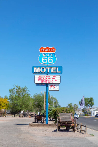 Seligman, USA - May 25, 2022: Motel and Route 66 sign  on Historic Route 66. Built in 1904. The neon light lost color but is still in use.