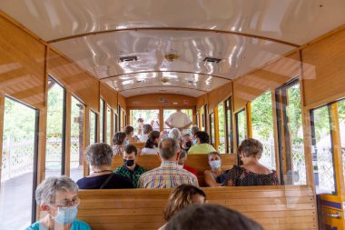 Wiesbaden, Germany - August 18, 2022:people enjoy the ride in the water driven Neroberg Train from 1888   at the Neroberg. in Wiesbaden.