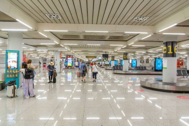 Palma de Mallorca, Spain - June 17, 2022: people pick up the baggage at Palma de Mallorca airport.