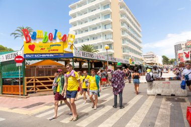 Palma de Mallorca, Spain - June 22, 2022: people have party at the Schinkenstrasse, engl: Ham Street at Ballermann - engl: fun man in Palma.