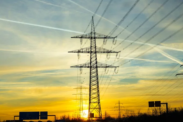 Scenic Sunset Seen Highway Electric Pylon Condensation Stripes Aircrafts Sky — Stock Photo, Image