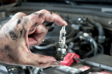 Auto mechanic and sparkplug clipart