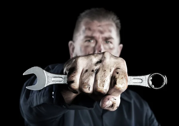 Mechanic holding wrench — Stock Photo, Image