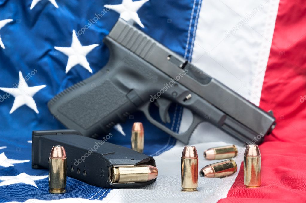 https://st.depositphotos.com/1066655/2024/i/950/depositphotos_20243265-stock-photo-pistol-on-flag.jpg