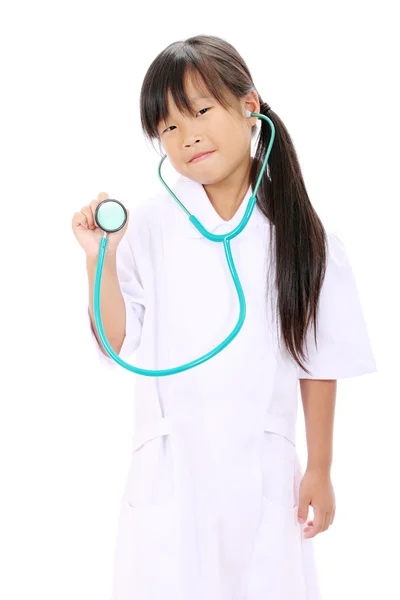 Kleine asiatische Mädchen in Uniform Stockfoto