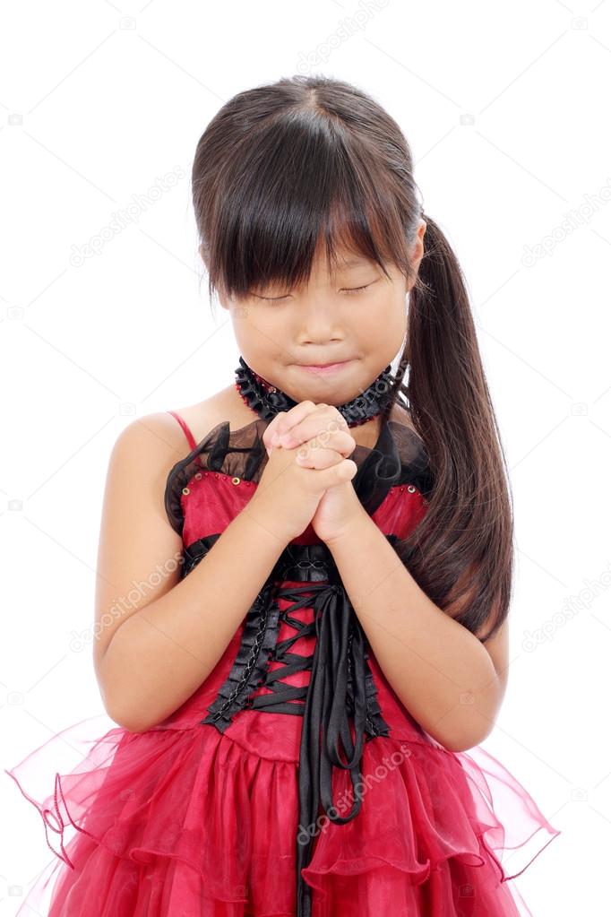 Little asian girl praying