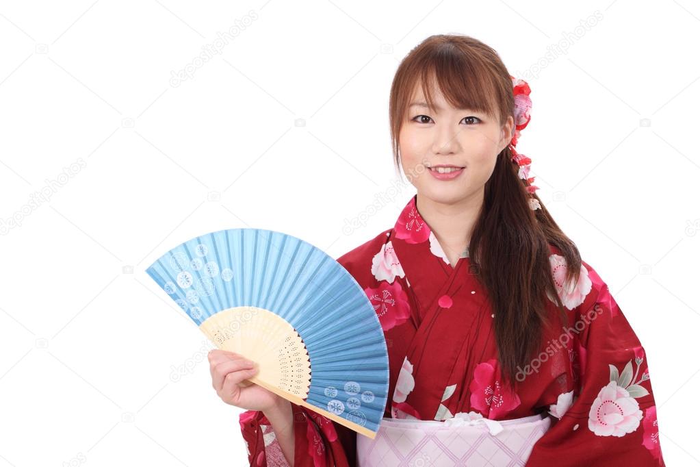 Young asian woman with paper fan