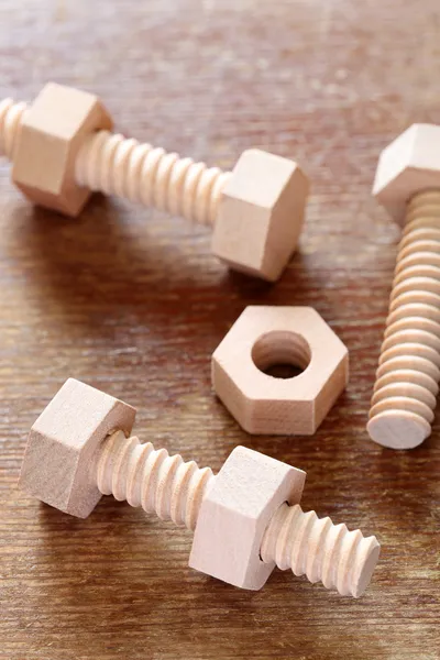 Wooden nuts and bolts — Stock Photo, Image