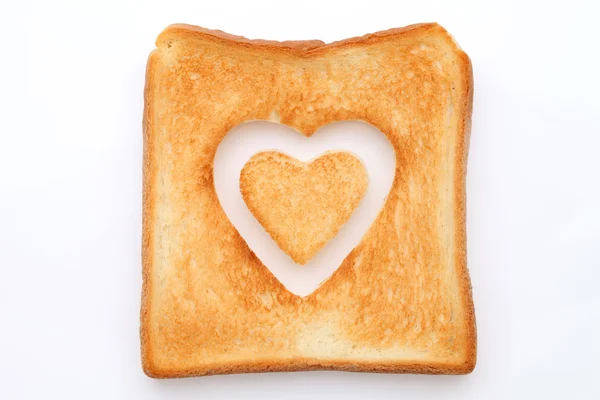 Toasted slice of bread with heart — Stock Photo, Image