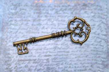 vintage key on a grungy blue leather background  