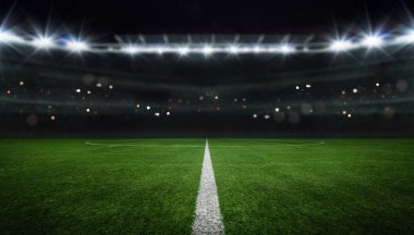 textured free soccer field in the evening light - center, midfield clipart