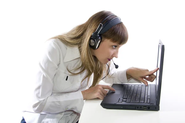 Woman with headphone working on laptop — Stock Photo, Image