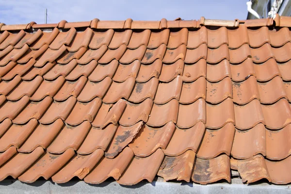 Red tile roof with gutter system and attic