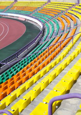 Rows of plastic seats at stadium
