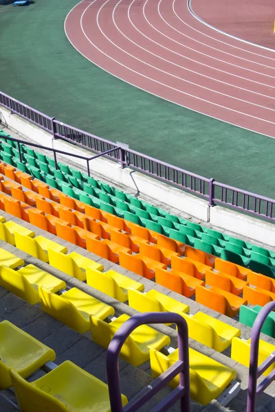 Rows of plastic seats at stadium