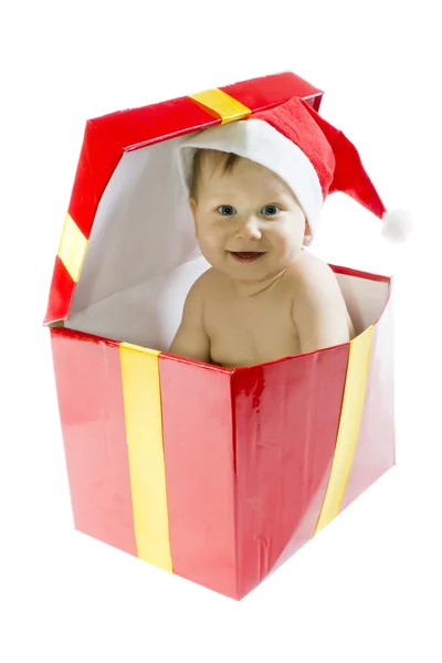 Blauäugiges Baby mit Weihnachtsmütze im Geschenkkarton — Stockfoto