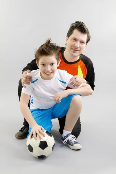Father and son with football ball — Stock Photo, Image